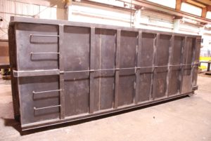 new JT Fabrication forty yard roll off container welded and ready for paint